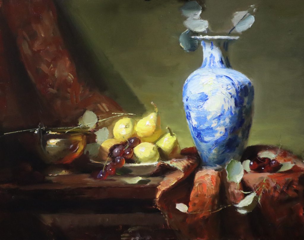 A photo of an original oil painting on panel of a still life painting of a Delft Blue Vase and a plate of pears by Kelli Folsom.