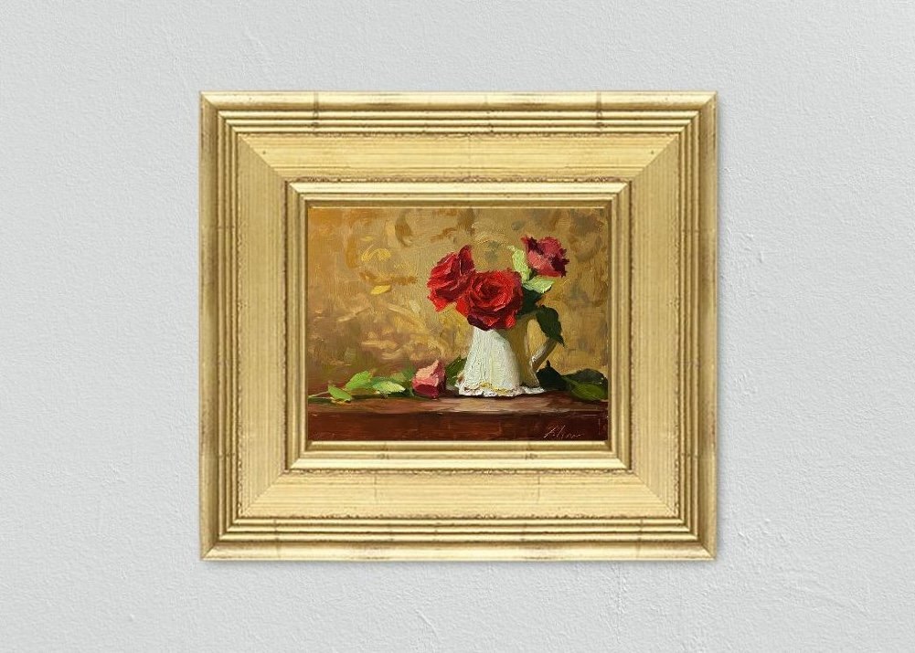 Explore the timeless elegance of an 8x10 inch still life oil painting by Kelli Folsom, showcasing vibrant red roses in a creamer pitcher on a tabletop. Painted in Folsom's distinctive loose style, this artwork captures the romantic allure of the roses against the soft creamer pitcher and tabletop backdrop. The loose brushwork infuses the composition with a sense of spontaneity and movement, inviting viewers to immerse themselves in the beauty of the scene. Bring a touch of floral sophistication to your space with this captivating artwork by Folsom.