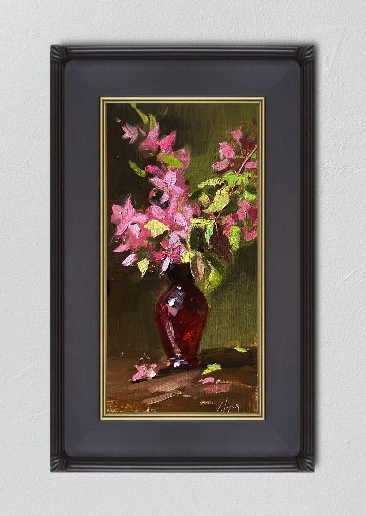 Experience the delicate beauty of cherry blossoms in a 6x12 inch still life oil painting by Kelli Folsom. Painted in Folsom's signature loose style, this artwork captures the ethereal quality of the blooms against the vibrant backdrop of a red glass vase. The loose brushwork lends a sense of movement and spontaneity to the composition, evoking the fleeting nature of springtime. Add a touch of elegance to your space with this captivating artwork by Folsom, celebrating the timeless charm of nature's bounty.
