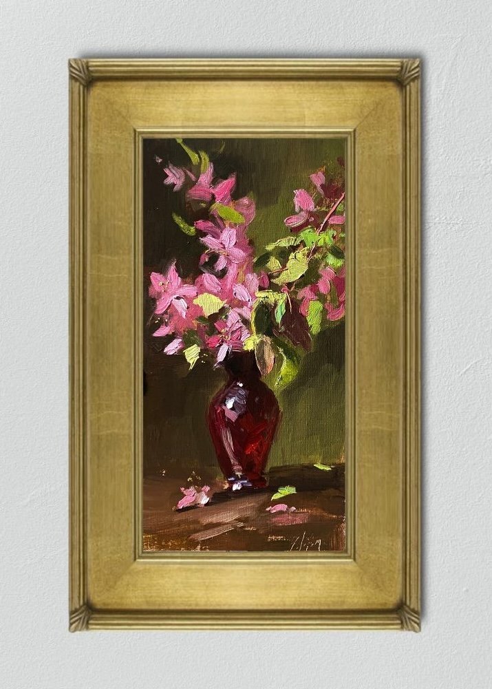 Experience the delicate beauty of cherry blossoms in a 6x12 inch still life oil painting by Kelli Folsom. Painted in Folsom's signature loose style, this artwork captures the ethereal quality of the blooms against the vibrant backdrop of a red glass vase. The loose brushwork lends a sense of movement and spontaneity to the composition, evoking the fleeting nature of springtime. Add a touch of elegance to your space with this captivating artwork by Folsom, celebrating the timeless charm of nature's bounty.