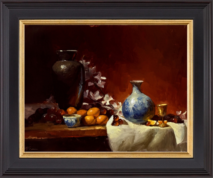 Classical still life oil painting featuring a black urn, a blue and white porcelain vase, and assorted fruit including oranges, grapes, and cherries, arranged with a gold cup and white cloth on a table against a rich red background.