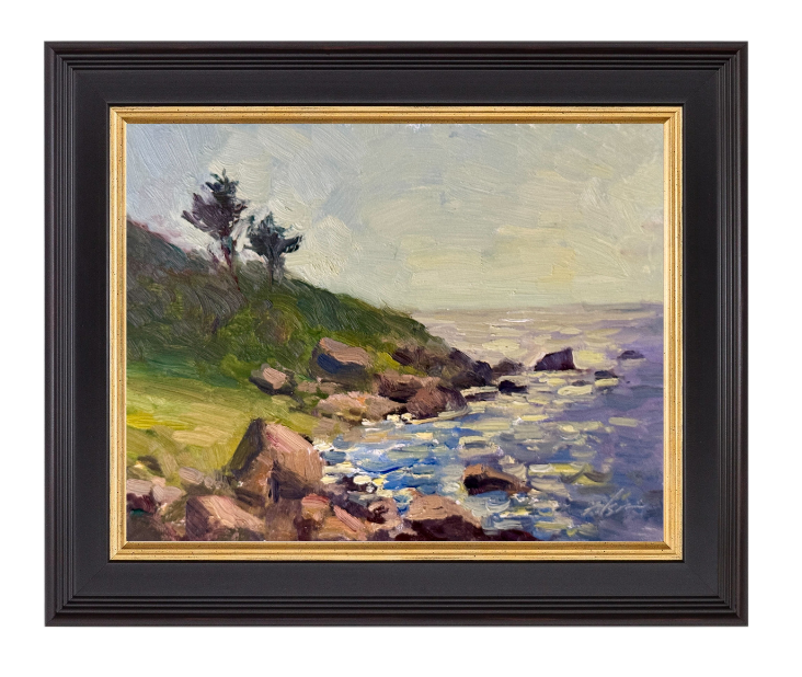 Seaside oil painting of rocky cliffs with distant trees, rugged shoreline, and shimmering ocean waves beneath a hazy sky.
