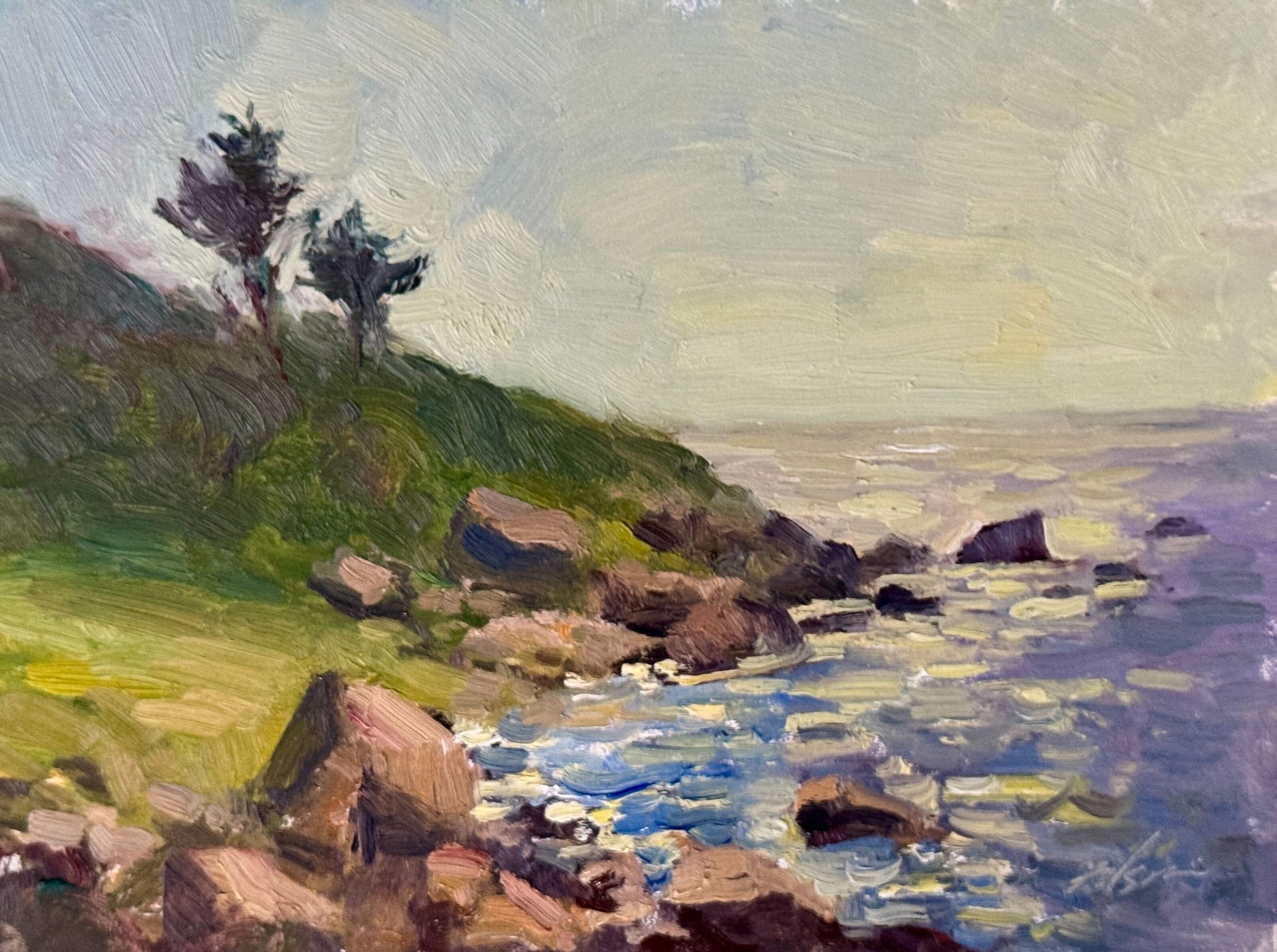 Seaside oil painting of rocky cliffs with distant trees, rugged shoreline, and shimmering ocean waves beneath a hazy sky.