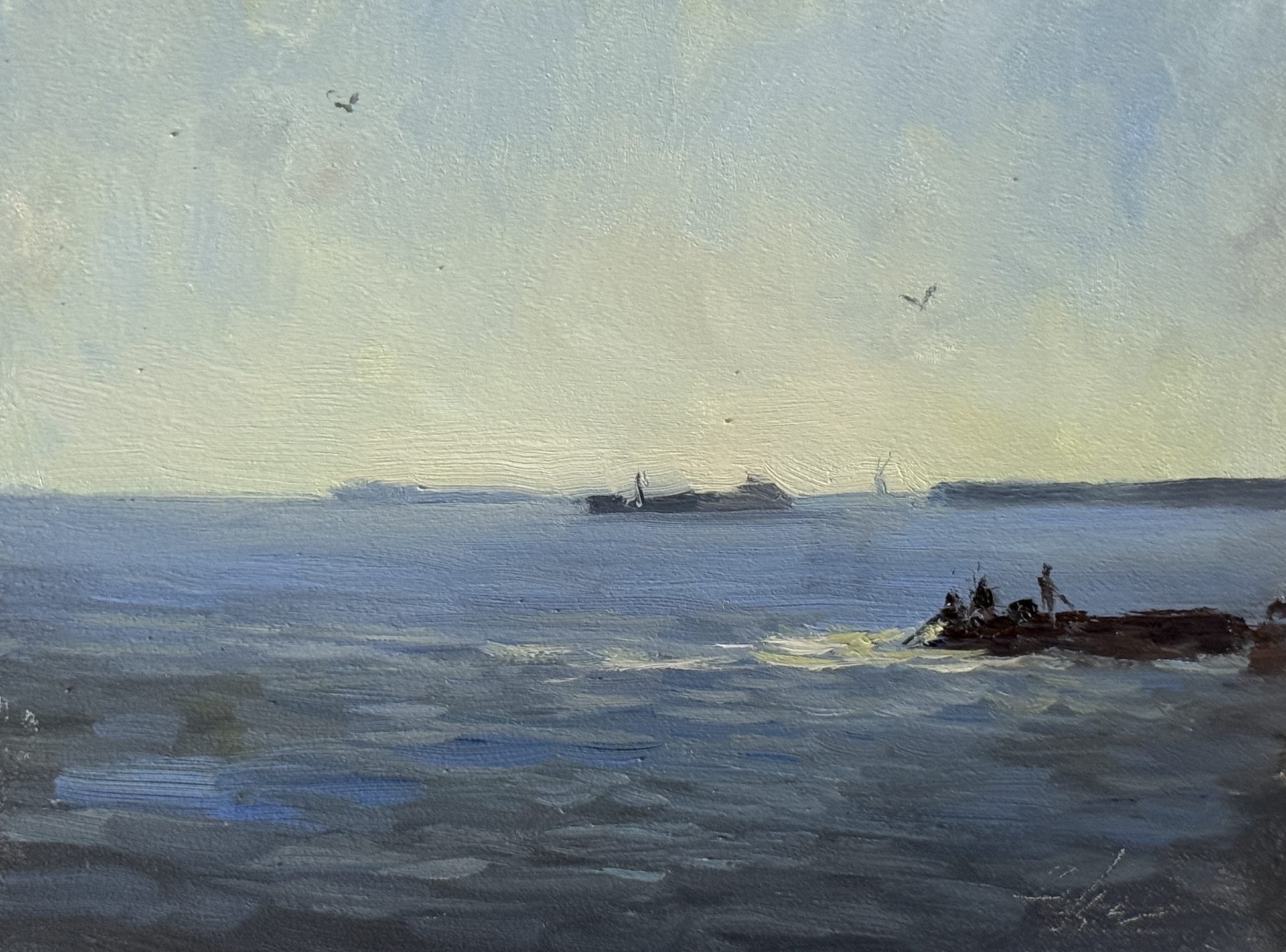 In this serene seascape, the water lies still beneath a pale sky, holding the delicate balance between calm and quiet industry. A distant barge glides along the horizon, its slow journey mirrored by the patient fisherman in the foreground, each hoping for their daily reward. Above, gulls drift effortlessly, scanning the water for their next meal or a place to rest. Painted from life, this piece captures not only the beauty of the sea but also the rhythm of the lives it sustains.