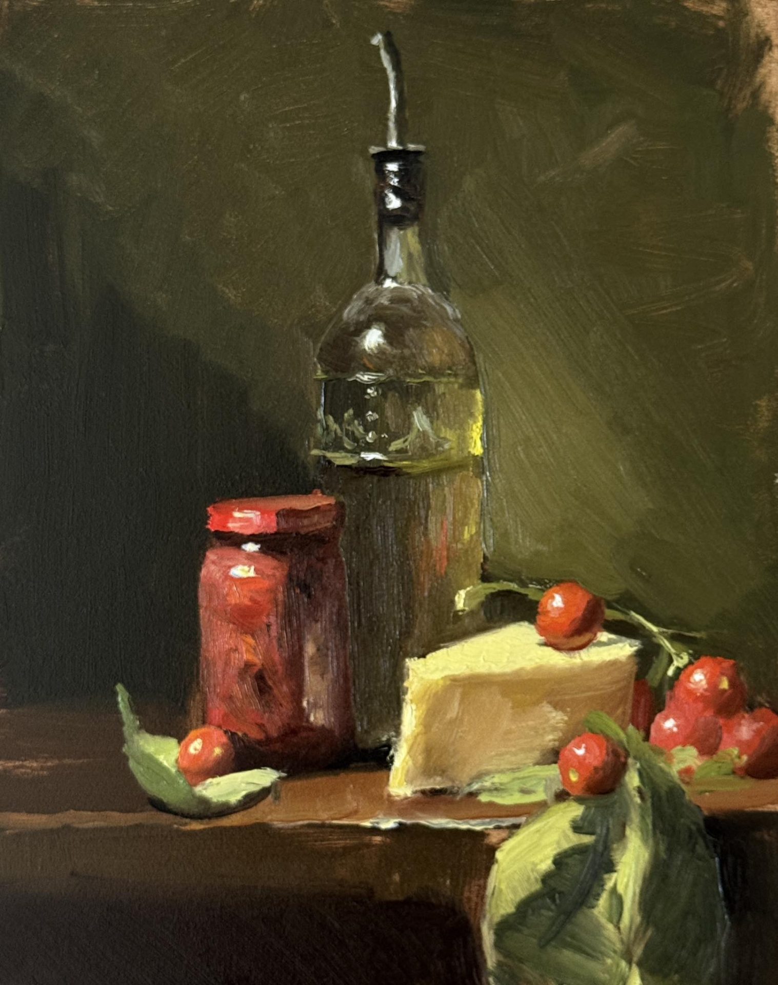 Still life oil painting of Italian cooking ingredients with a glass olive oil bottle, wedge of Parmesan cheese, jar of sun-dried tomatoes, and fresh cherry tomatoes with basil leaves on a wooden table.