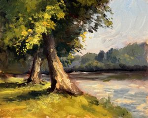Oil painting of two sunlit trees along a calm riverbank, with soft reflections on the water and hazy distant hills.