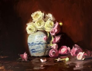 Oil painting of a blue-and-white ceramic vase filled with white and pink ranunculus flowers, set against a rich dark background.