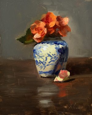 Small oil still life painting of orange begonias arranged in a blue-and-white porcelain vase on a dark reflective tabletop with soft neutral background.