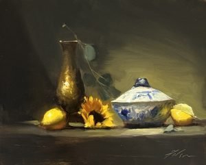 Original oil painting featuring a blue and white porcelain tureen, bronze vase, sunflower, and fresh lemons in dramatic natural light. Contemporary impressionist still life, oil on panel.