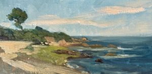 Original oil painting of a peaceful rocky coastline with blue ocean waves, sandy shoreline, green trees, and a soft sky with wispy clouds, painted on panel.